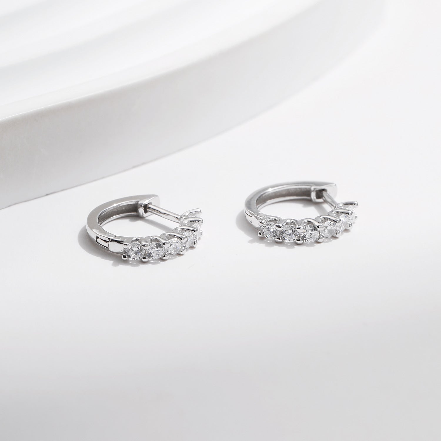 Crystal Huggie Hoop Earrings – Silver Moissanite